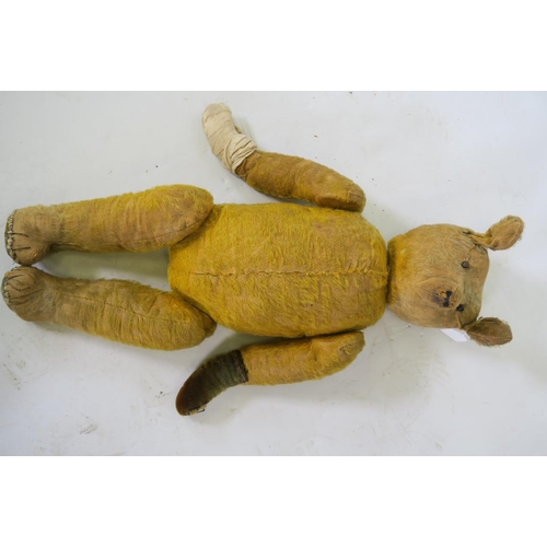 62 - An early C20th teddy bear, 23