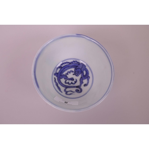 8 - A Chinese blue and white porcelain rice bowl decorated with dragons, 4 character mark to base, 4½