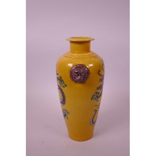 10 - A Chinese sancai glazed porcelain vase, with two lion mask handles and decorated with dragons, 6 cha... 