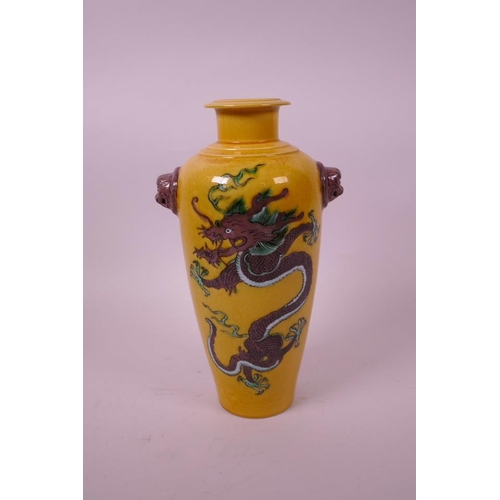 10 - A Chinese sancai glazed porcelain vase, with two lion mask handles and decorated with dragons, 6 cha... 