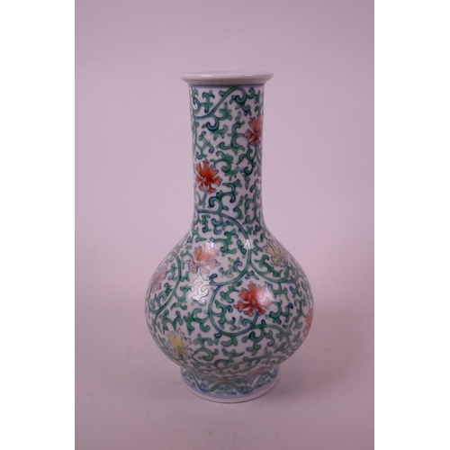 15 - A Chinese doucai porcelain bottle vase, with scrolling foliate decoration, seal mark to base, 8½