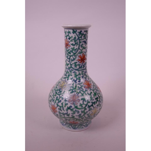 15 - A Chinese doucai porcelain bottle vase, with scrolling foliate decoration, seal mark to base, 8½