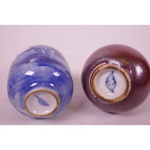 21 - A small copper glazed porcelain scent bottle, together with a blue and white scent bottle, leaf mark... 