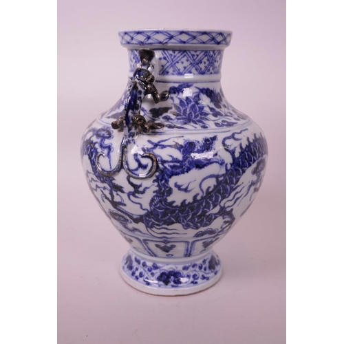 25 - A Chinese blue and white pottery vase, with two dragon handles and painted twin dragon decoration, f... 