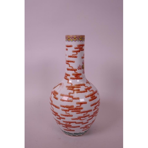 30 - A Chinese polychrome porcelain bottle vase, decorated with a red and gilt dragon chasing the flaming... 