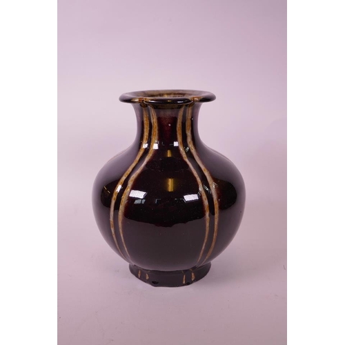 35 - A large Chinese pottery vase of lobed form with a burgundy glaze, 9