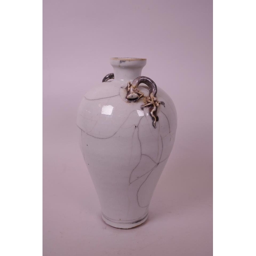 40 - A Chinese white crackle ground pottery vase, with two handles in the form of dragons, 9½