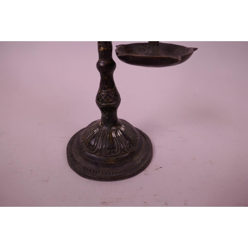 42 - An Indian patinated bronze hanging oil lamp, in the form of a parrot on its perch, 10½