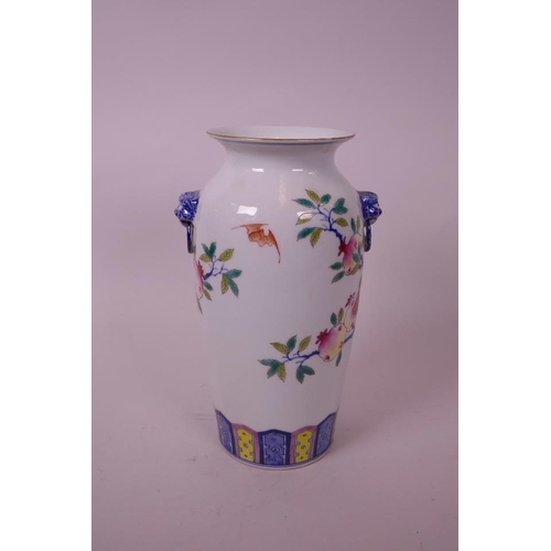 45 - A Chinese polychrome porcelain vase with kylin mask handles, decorated with a fruiting pomegranate t... 