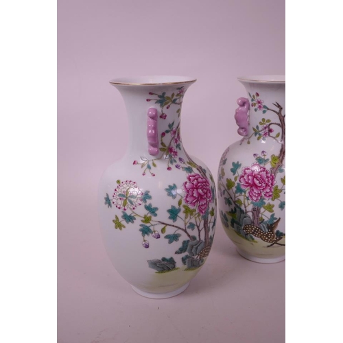 48 - A pair of Chinese polychrome porcelain two handled vases, decorated with deer in a landscape, seal m... 