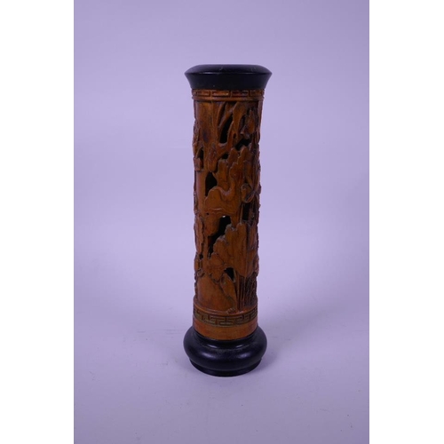 5 - A Chinese carved wood cylinder incense burner, decorated with carp in a lotus pond, 9½