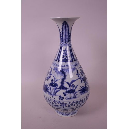 55 - A Chinese Ming style blue and white pottery pear shaped vase, decorated with waterfowl in a lotus po... 