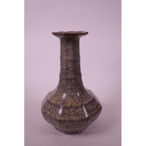 58 - A Chinese grey crackle glazed pottery vase, of octagonal form with a ribbed neck, 9½