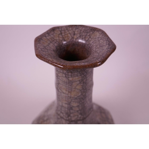 58 - A Chinese grey crackle glazed pottery vase, of octagonal form with a ribbed neck, 9½