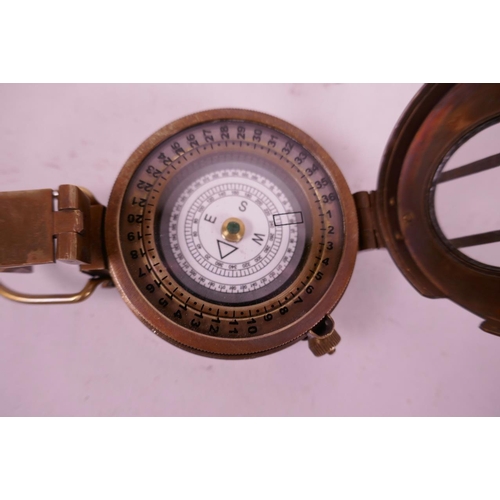 6 - A replica brass sighting compass, marked TG and Co, London, 2½