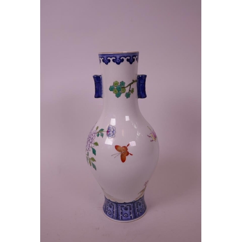 60 - A Chinese polychrome enamelled porcelain vase, with two lug handles, decorated with a phoenix amongs... 