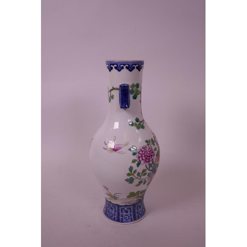 60 - A Chinese polychrome enamelled porcelain vase, with two lug handles, decorated with a phoenix amongs... 