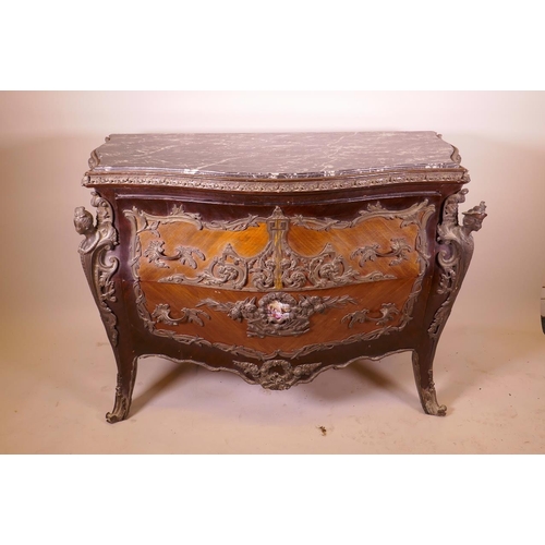 1210 - A Louis XV style tulipwood bombe shapped commode with brass mounts and inset marble top, 48