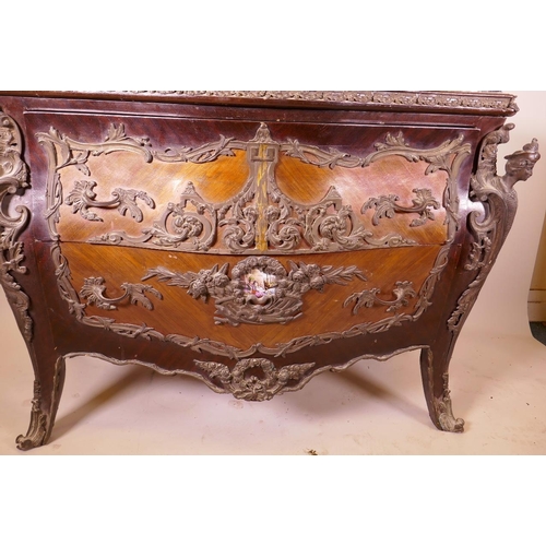 1210 - A Louis XV style tulipwood bombe shapped commode with brass mounts and inset marble top, 48