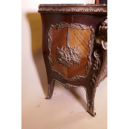 1210 - A Louis XV style tulipwood bombe shapped commode with brass mounts and inset marble top, 48