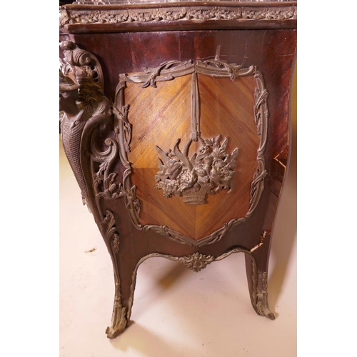 1210 - A Louis XV style tulipwood bombe shapped commode with brass mounts and inset marble top, 48