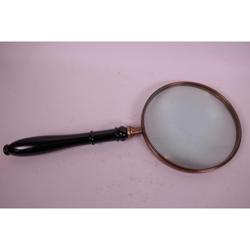 14 - A large brass framed magnifying glass with turned hardwood handle, 15