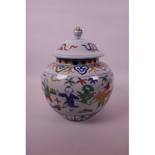 17 - A Chinese wucai porcelain jar and cover decorated with children in a garden, 6 character mark to bas... 