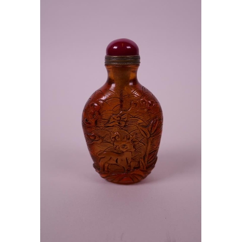 20 - A Peking glass snuff bottle with carved stork and deer decoration, 3½