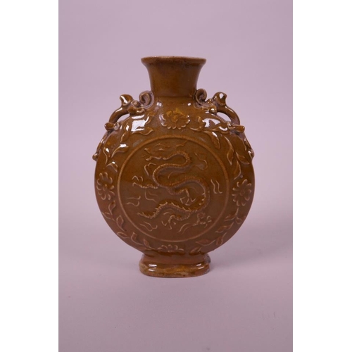 35 - A Chinese ochre glazed moon flask with two dragon handles and decoration, chips to base, 5