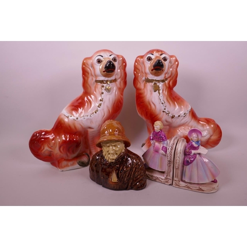 36 - A pair of Staffordshire flatback figures of spaniels, 11