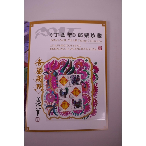 39 - A wallet of facsimile (replica) Chinese stamps commemorating the '2017 Year of the Rooster', 9