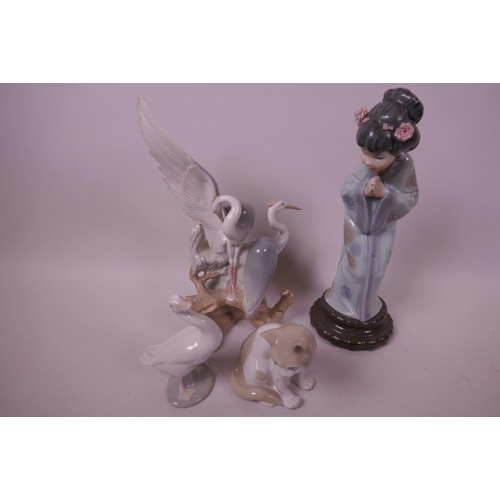 42 - A Lladro figurine of a young girl, 10½