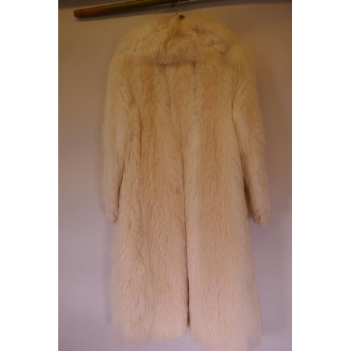 52 - A good quality three quarter length Arctic fox fur coat with silk lining