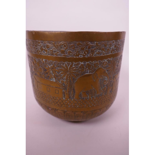 9 - An Indian brass planter having chased and engraved decoration of elephants, trees and buildings, 6¾