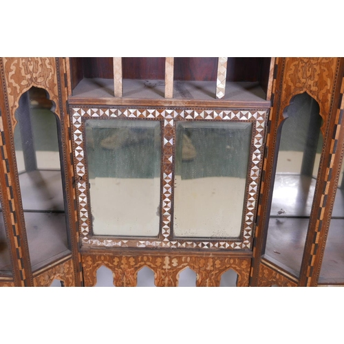 1215 - A late C19th Moorish side cabinet in the manner of Liberty, constructed of rosewood, inlaid with mot... 