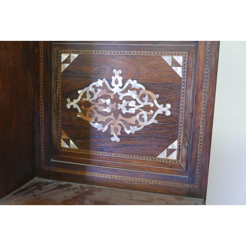 1215 - A late C19th Moorish side cabinet in the manner of Liberty, constructed of rosewood, inlaid with mot... 