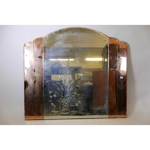 1229 - An Art Deco wall mirror, with cut glass decoration and shaped top, 54