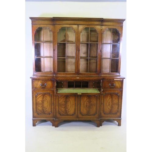 1234 - A small 'Jaycee' Regency style breakfront secretaire bookcase, the glazed upper section over two dra... 