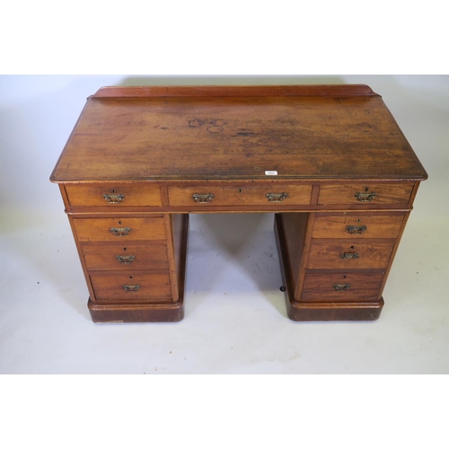 1216 - A C19th mahogany nine drawer pedestal desk, 48