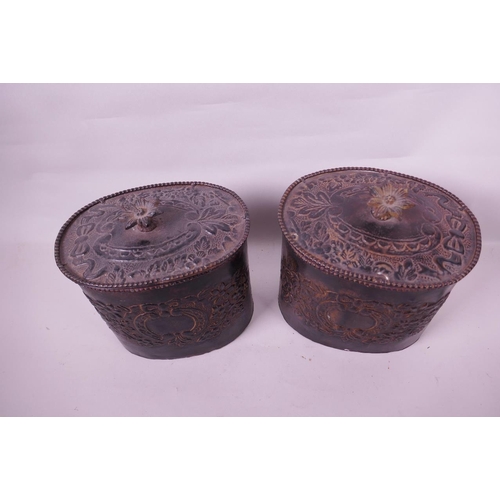 1 - A pair of vintage metal canisters with embossed flower and swag decoration and cast flower handles, ... 