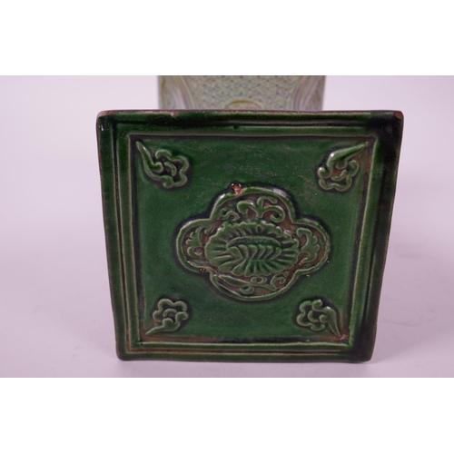 10 - A Chinese green glazed pottery pillow, with raised floral decoration, 6½