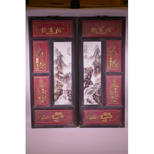 101 - A pair of large Chinese polychrome porcelain panels decorated with mountain landscape scenes, mounte... 