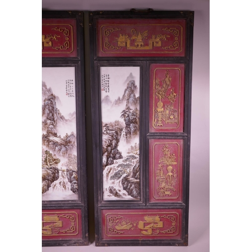 101 - A pair of large Chinese polychrome porcelain panels decorated with mountain landscape scenes, mounte... 