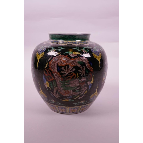 108 - A Chinese famille verte porcelain jar with enamel dragon decoration on a black ground, 6 character m... 