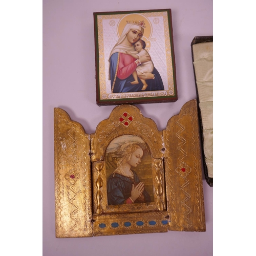 112 - A painted gilt folding frame opening to reveal an image of the Virgin, 5½