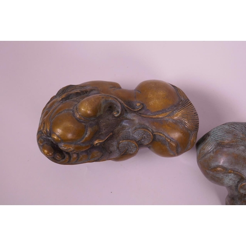 118 - A pair of Chinese filled bronze kylin with green patina, impressed 4 character mark to base, 6½