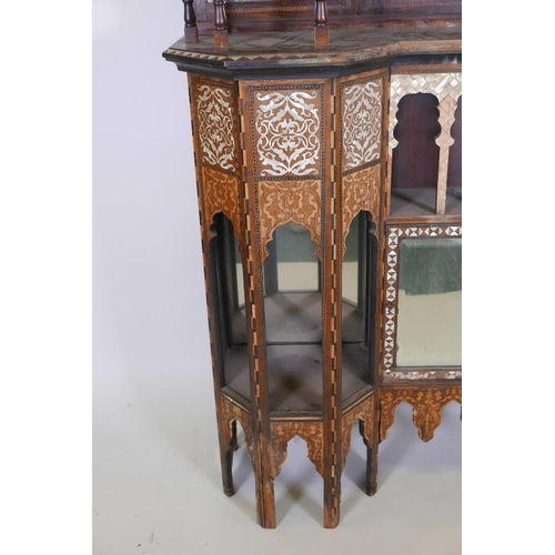 1215 - A late C19th Moorish side cabinet in the manner of Liberty, constructed of rosewood, inlaid with mot... 