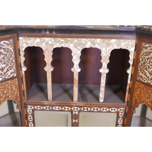 1215 - A late C19th Moorish side cabinet in the manner of Liberty, constructed of rosewood, inlaid with mot... 