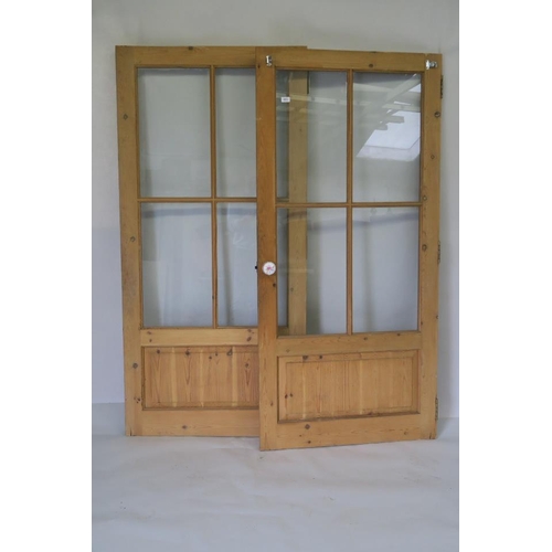 1228 - A pair of glazed pine doors, 70