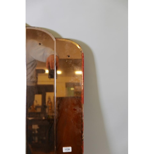 1229 - An Art Deco wall mirror, with cut glass decoration and shaped top, 54